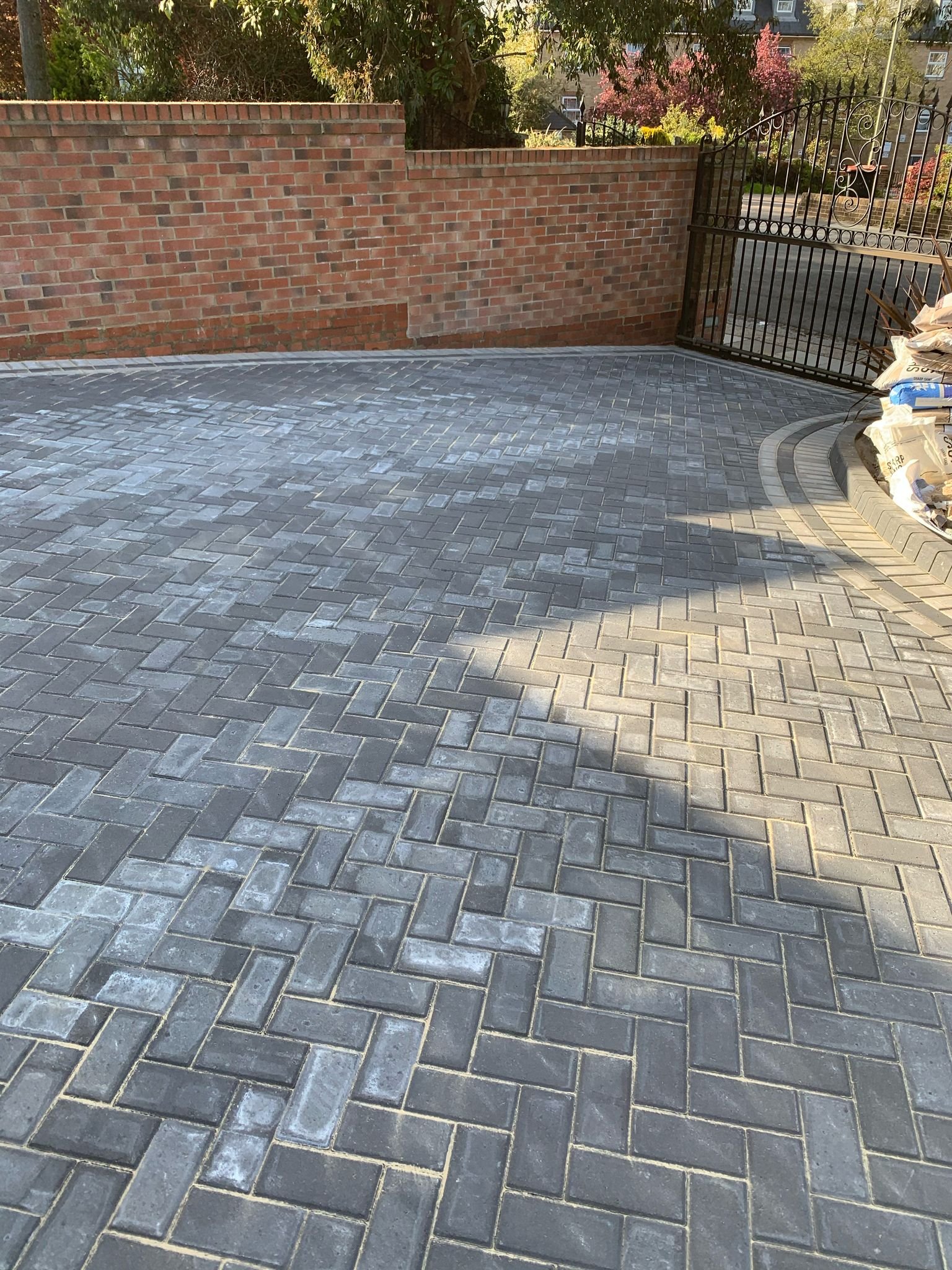 Block paving driveway with decorative brick border installed by MUHAJ in St Albans residential property
