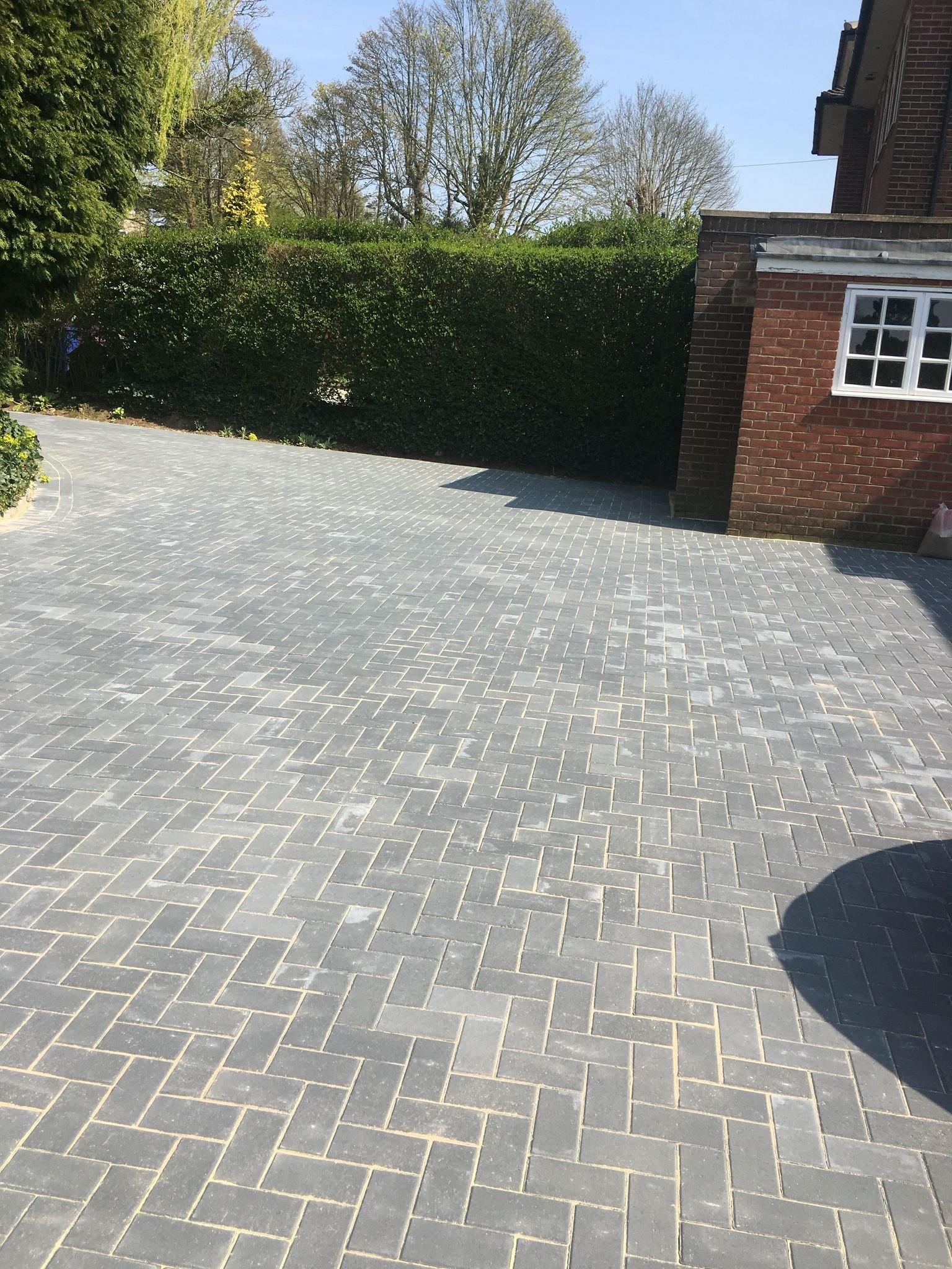 Completed block paving driveway with herringbone pattern by MUHAJ in Watford residential property