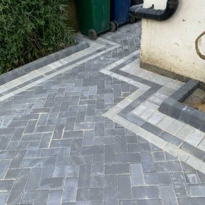 Detailed block paving with custom angular edging installed by MUHAJ in Barnet driveway project